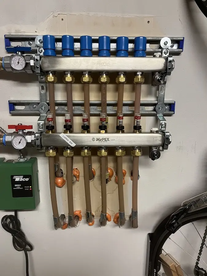 Plumber performing Water Heater Repair at a residential property in Salina